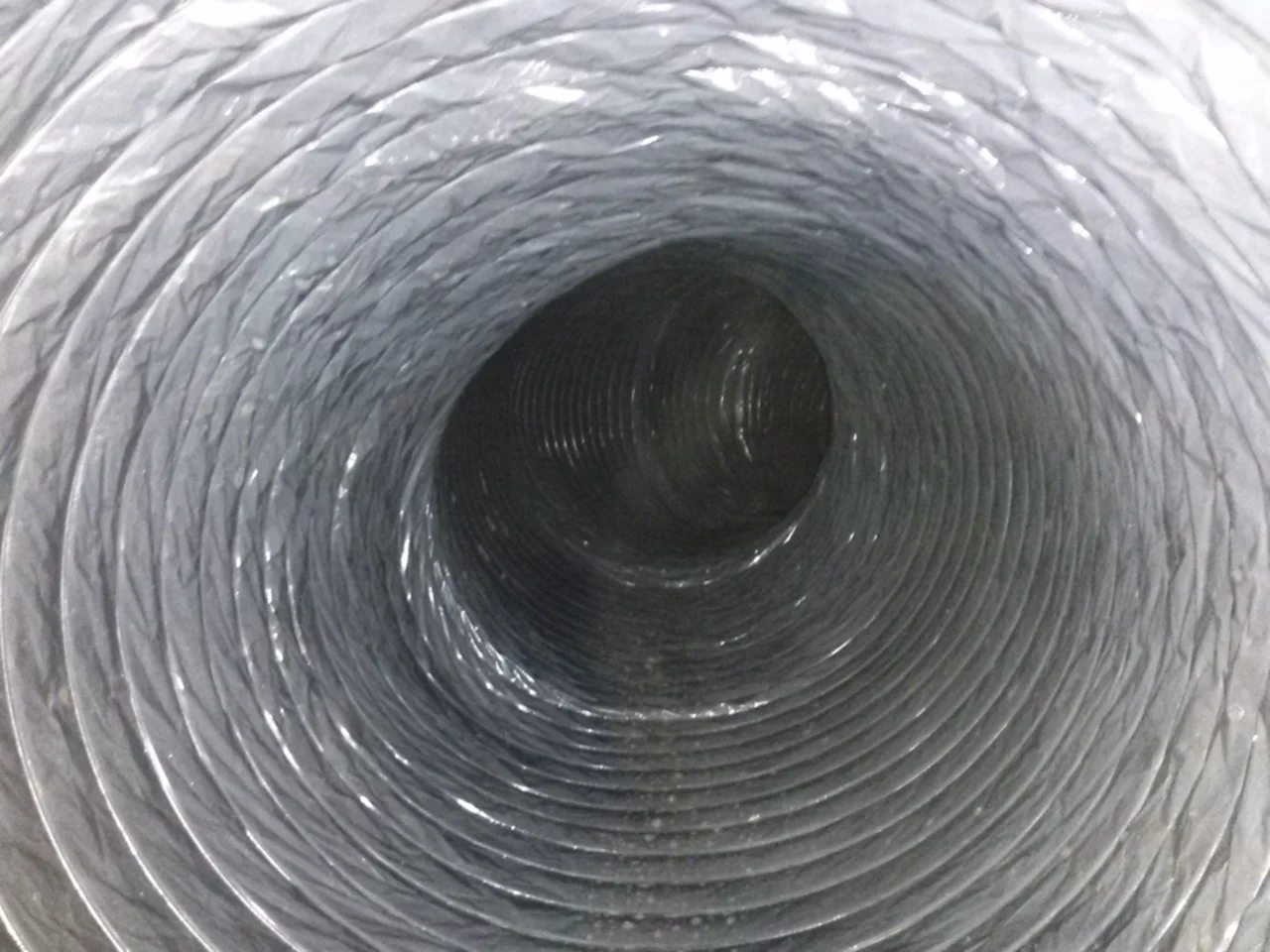 Clean flexible duct interior from a documented Cool Breeze job